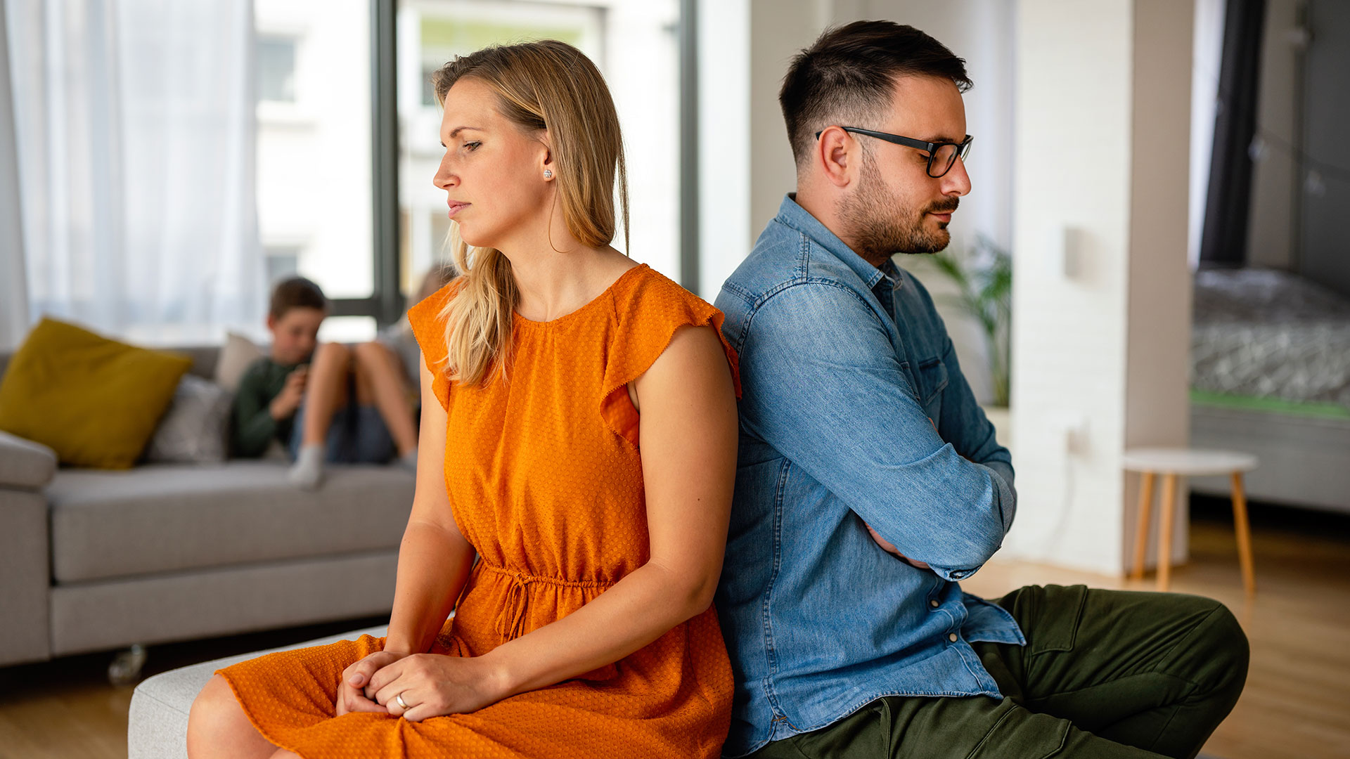 upset-couple-back-to-back-in-living-room-2026-09-24-07-04-22-utc
